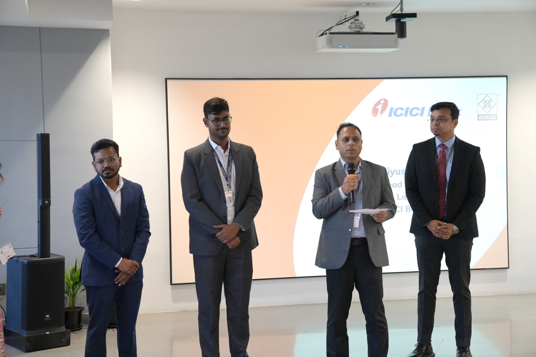 Members of the hosting team on stage during the session.